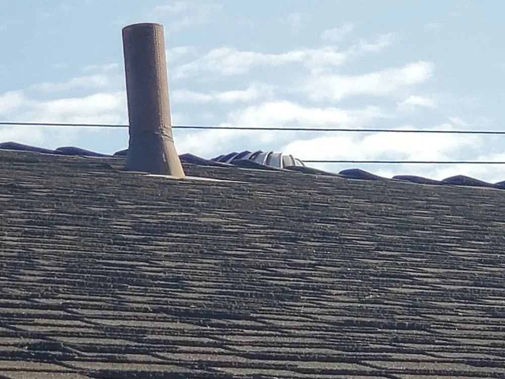 Slide of Mikes Roofing