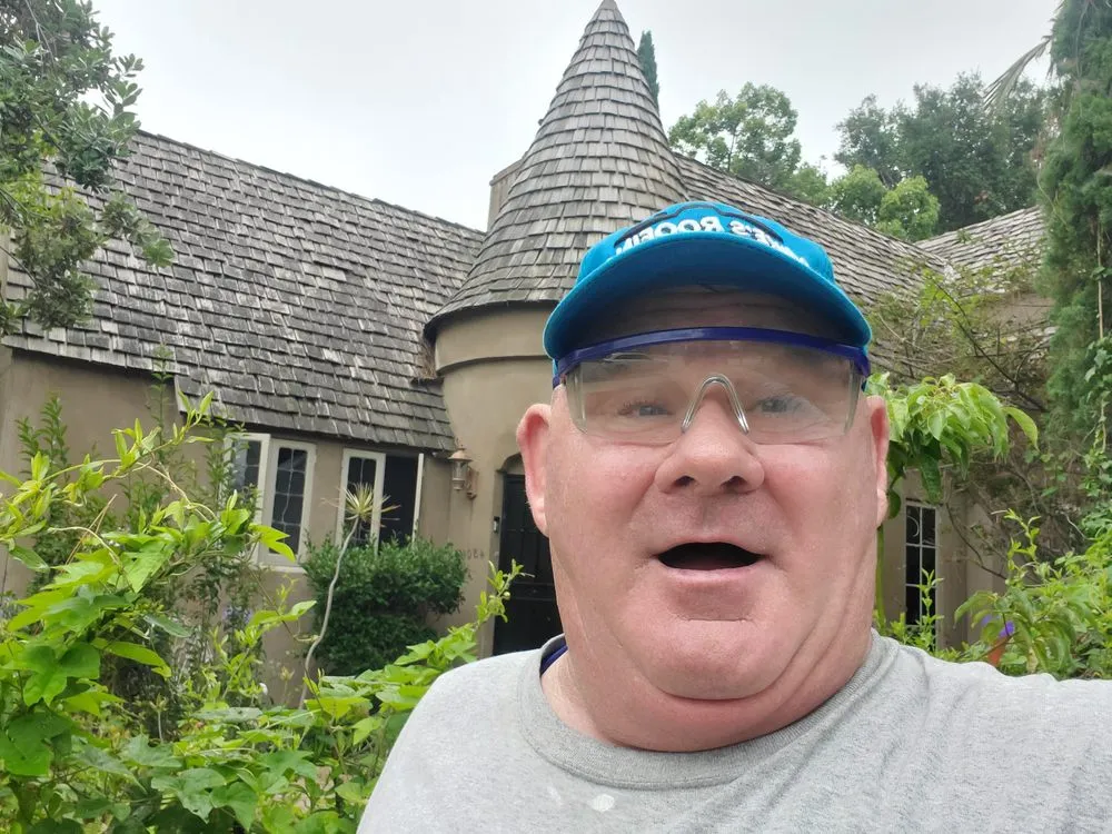 Slide of Mikes Roofing