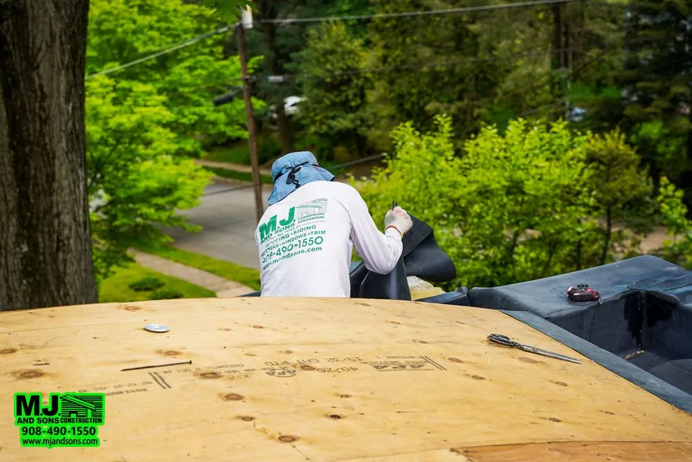 Slide of MJ and Sons Construction