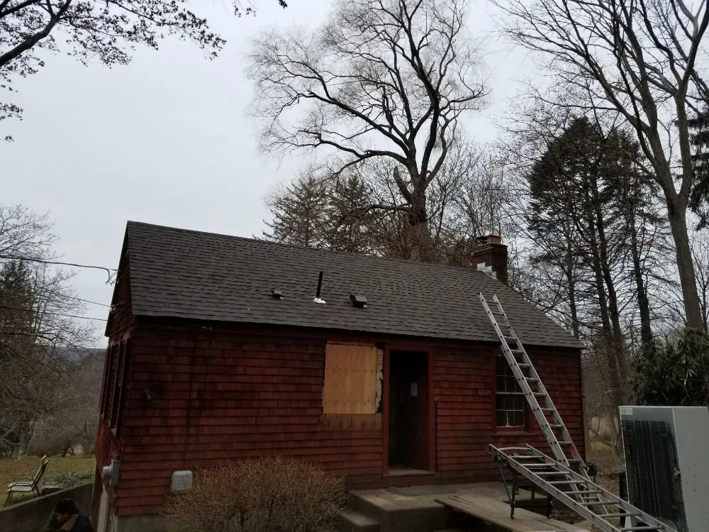 Slide of MJT Roofing