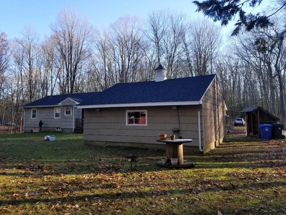 Slide of MJT Roofing
