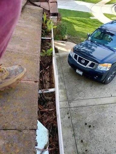 Slide of ML Gutters & Roofing