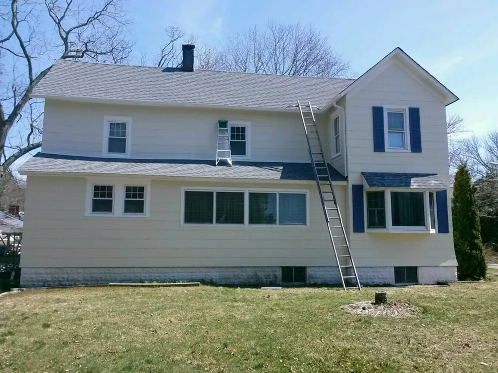 Slide of MNT Roofing & Siding