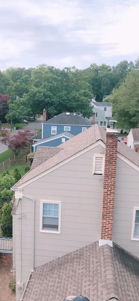 Slide of MNT Roofing & Siding