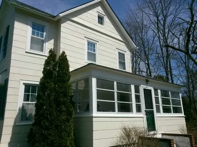 Slide of MNT Roofing & Siding