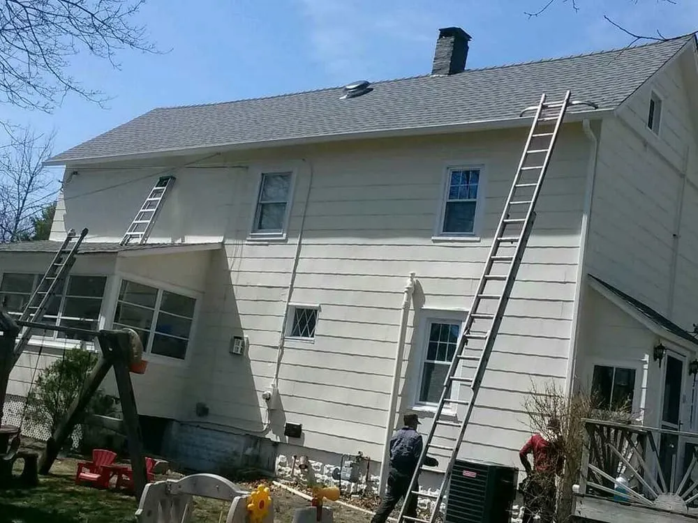 Slide of MNT Roofing & Siding