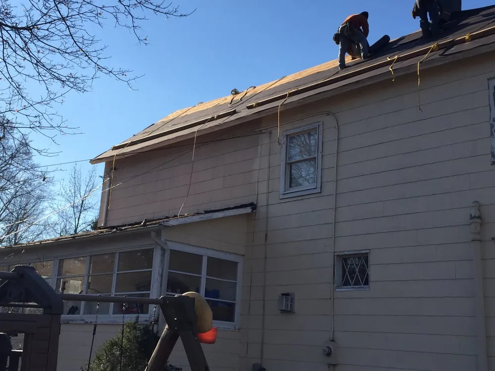 Slide of MNT Roofing & Siding