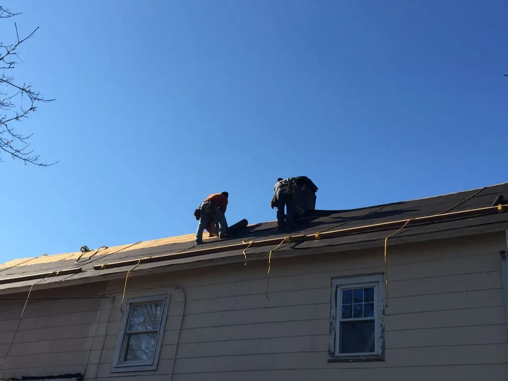 Slide of MNT Roofing & Siding