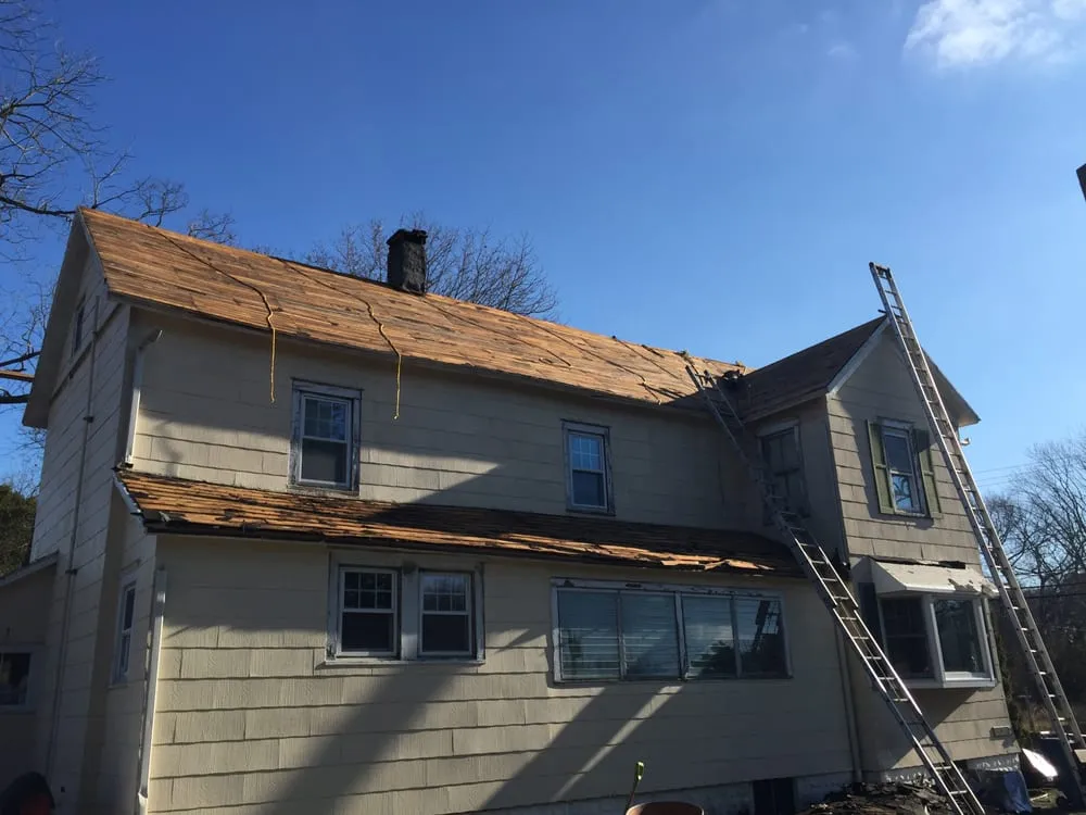 Slide of MNT Roofing & Siding