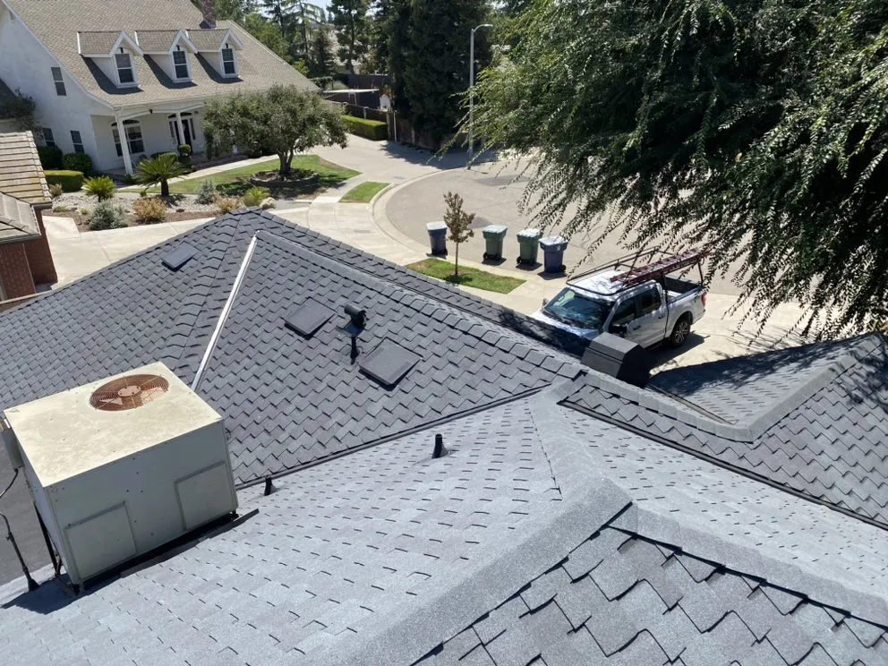 Slide of Modern Roofers and Restoration