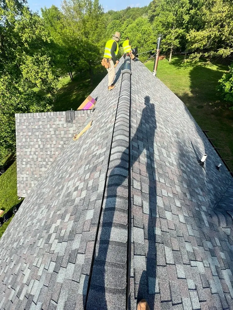 Slide of Motto's Roofing and Construction