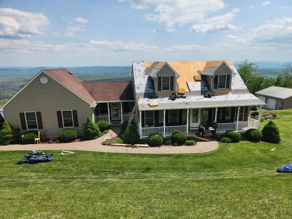 Emergency storm damage roof repair same-day service in Barton, MD by Mountain Home Improvement