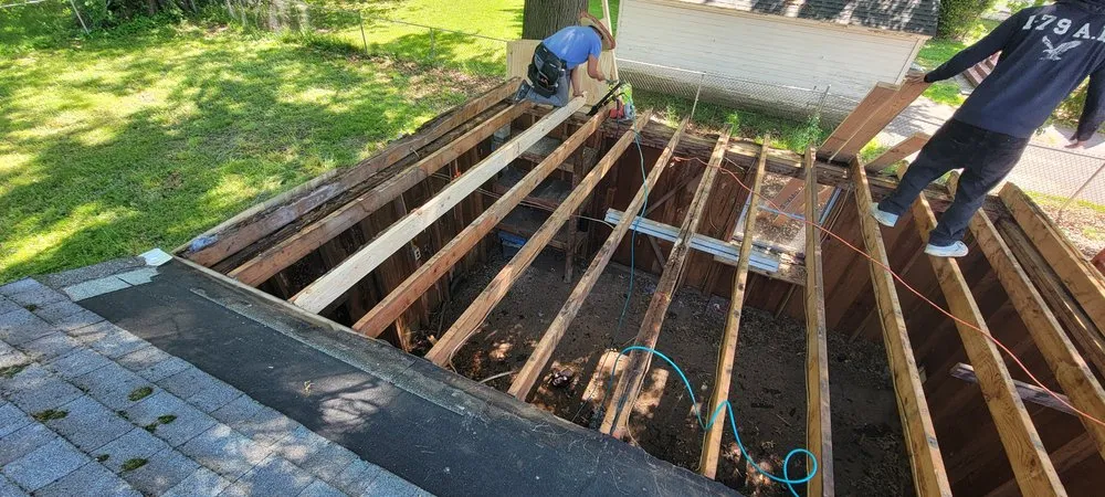 Slide of Muicela's Roofing