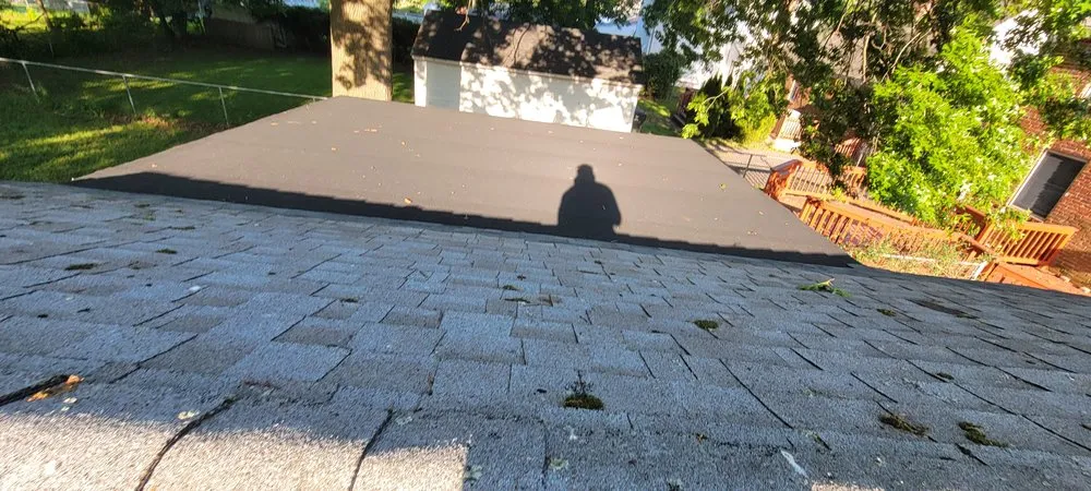 Slide of Muicela's Roofing