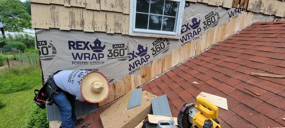 Slide of Muicela's Roofing