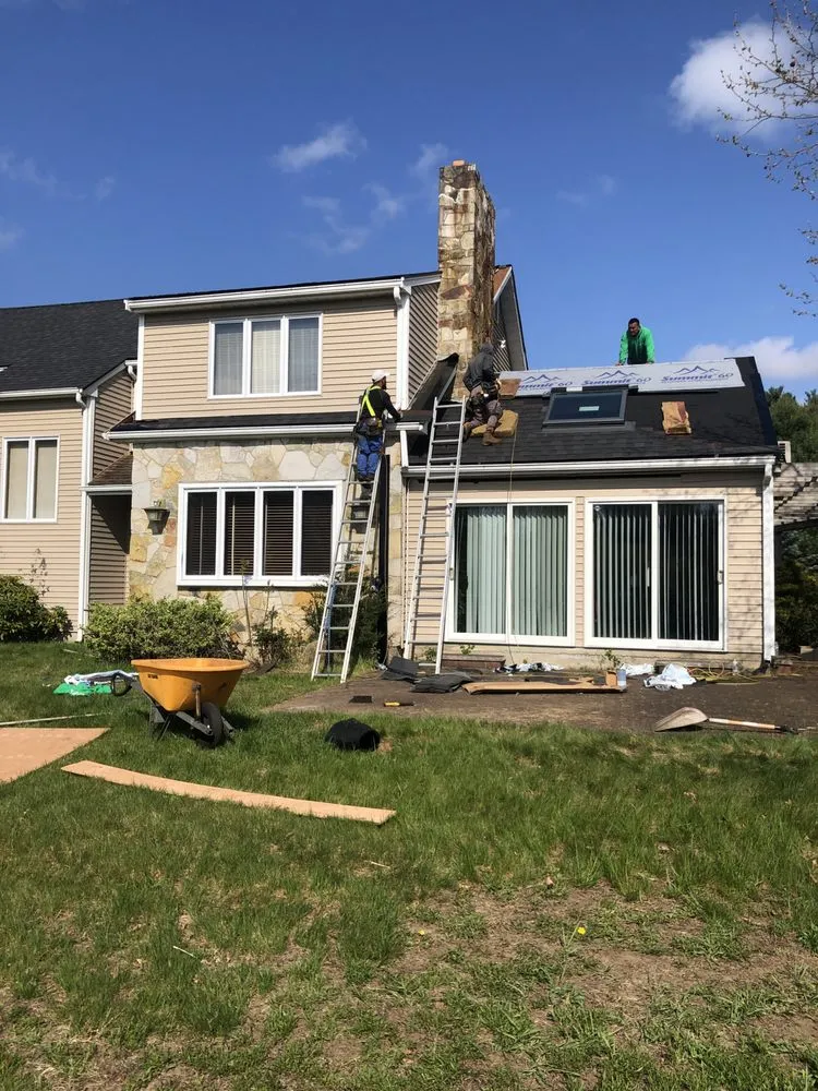 Slide of Munroe Roofing & Construction