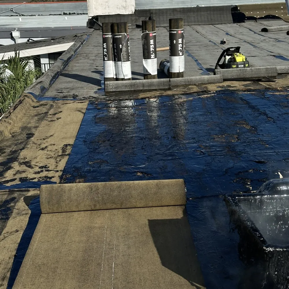 Slide of MZ Roofing Service