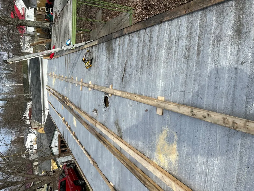 Slide of N’Amish Roofing