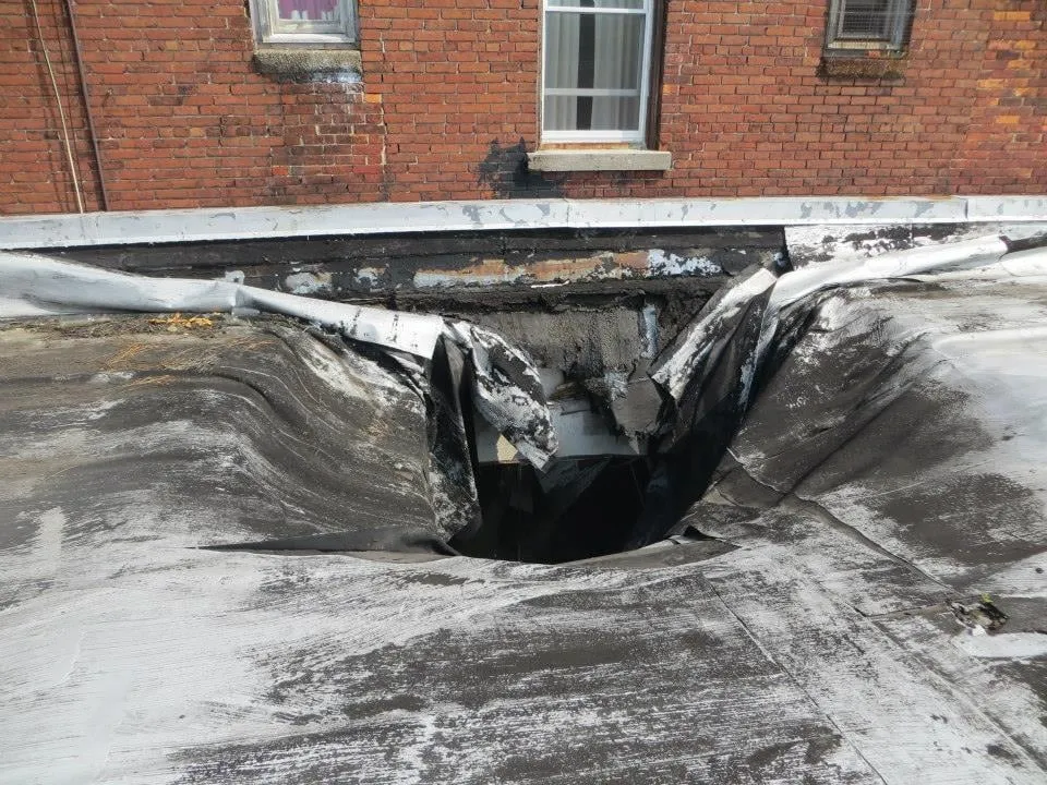 Slide of Naples Roofing