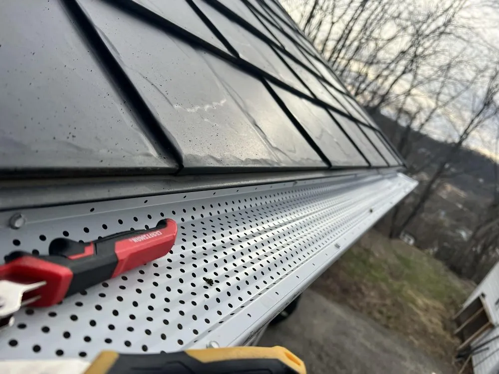 Slide of Nest Roofing & Gutters