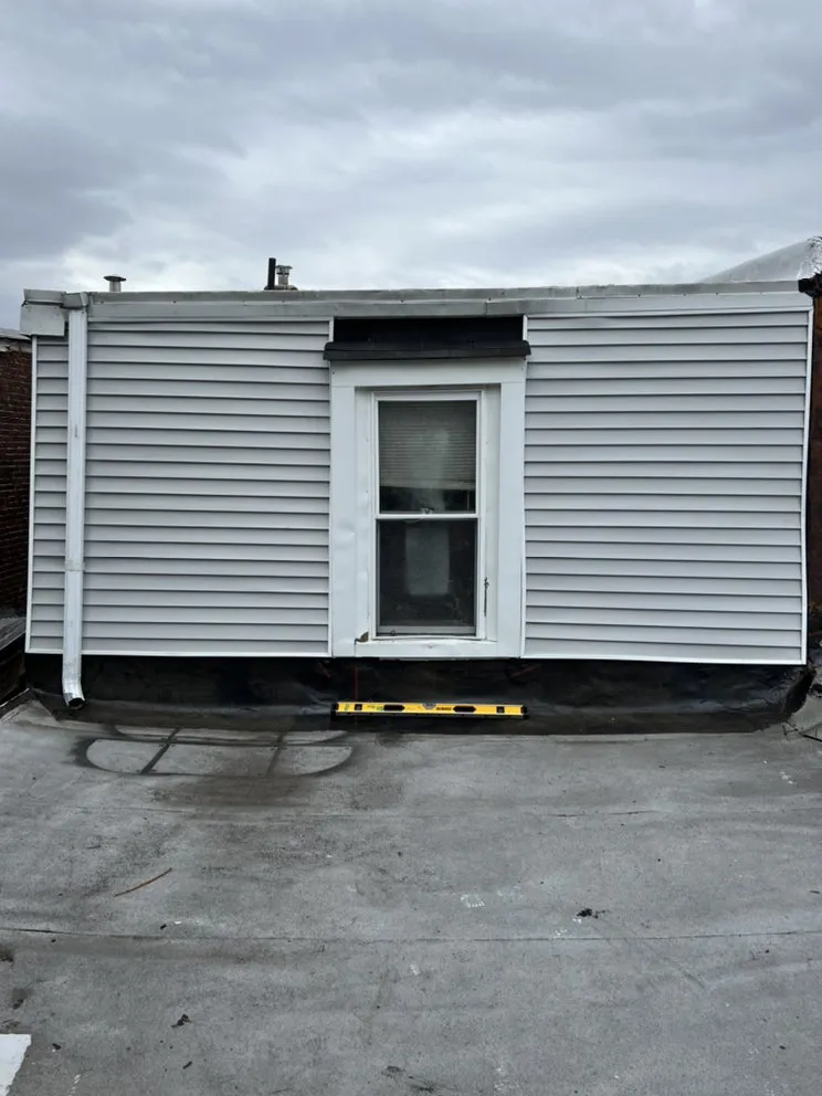 Slide of New Dynasty Roofing