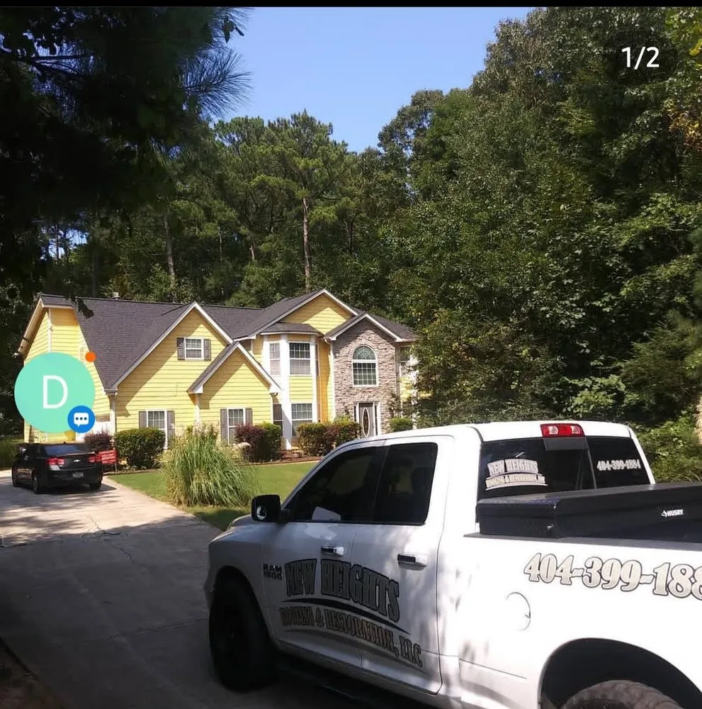 Slide of New Heights Roofing and Restoration