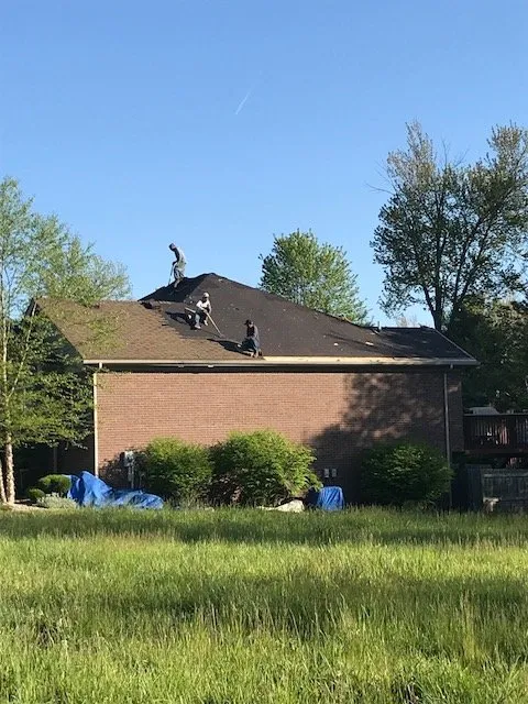 Slide of New Look Roofing