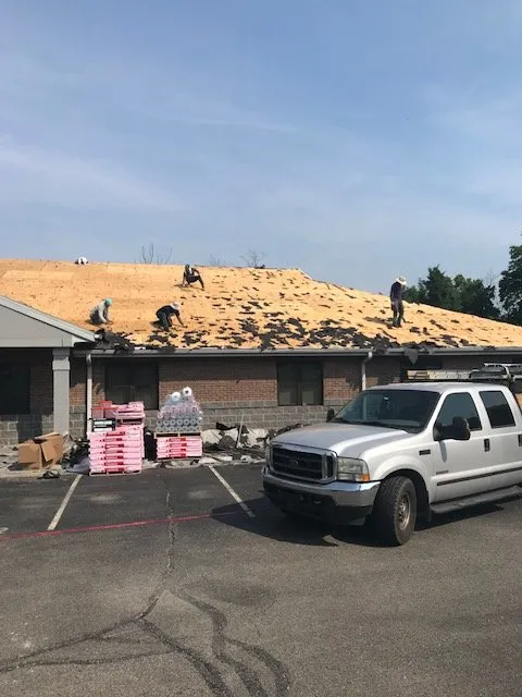 Slide of New Look Roofing