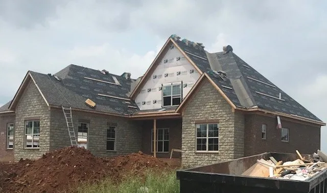 Slide of New Look Roofing