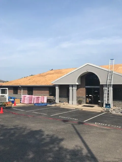 Slide of New Look Roofing