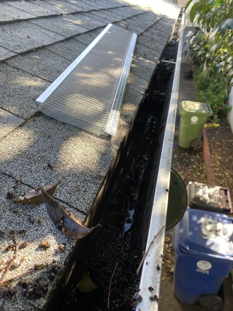 Slide of New Roof Repair Gutters