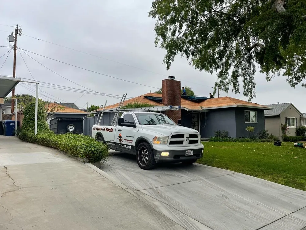 Slide of New Village Roofing