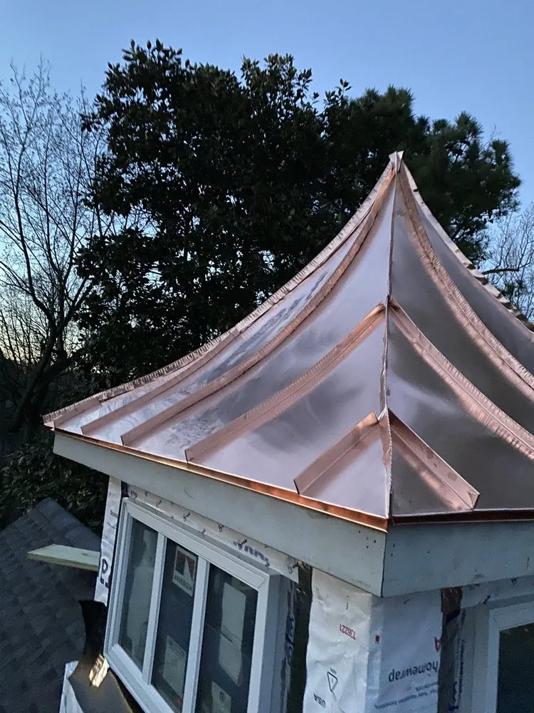 Slide of NHE Roofing