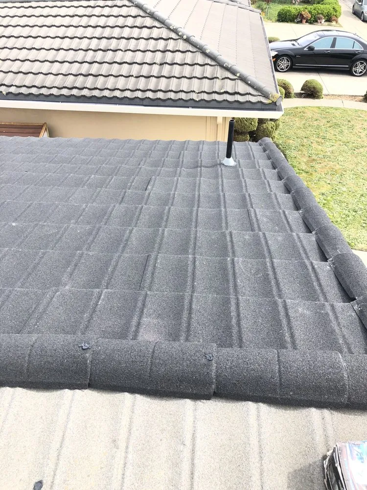 Slide of Nick’s Roofing