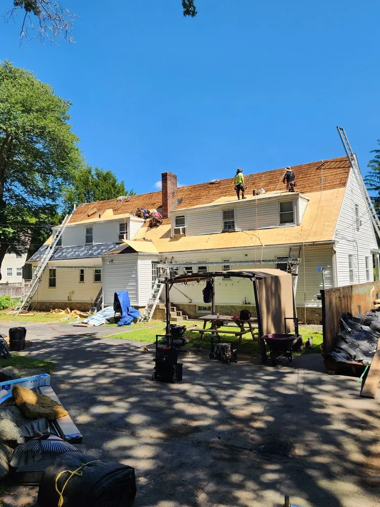 Licensed storm damage roof repair with free inspection across Whitinsville Ma, MA - Nor'Easter Roofing