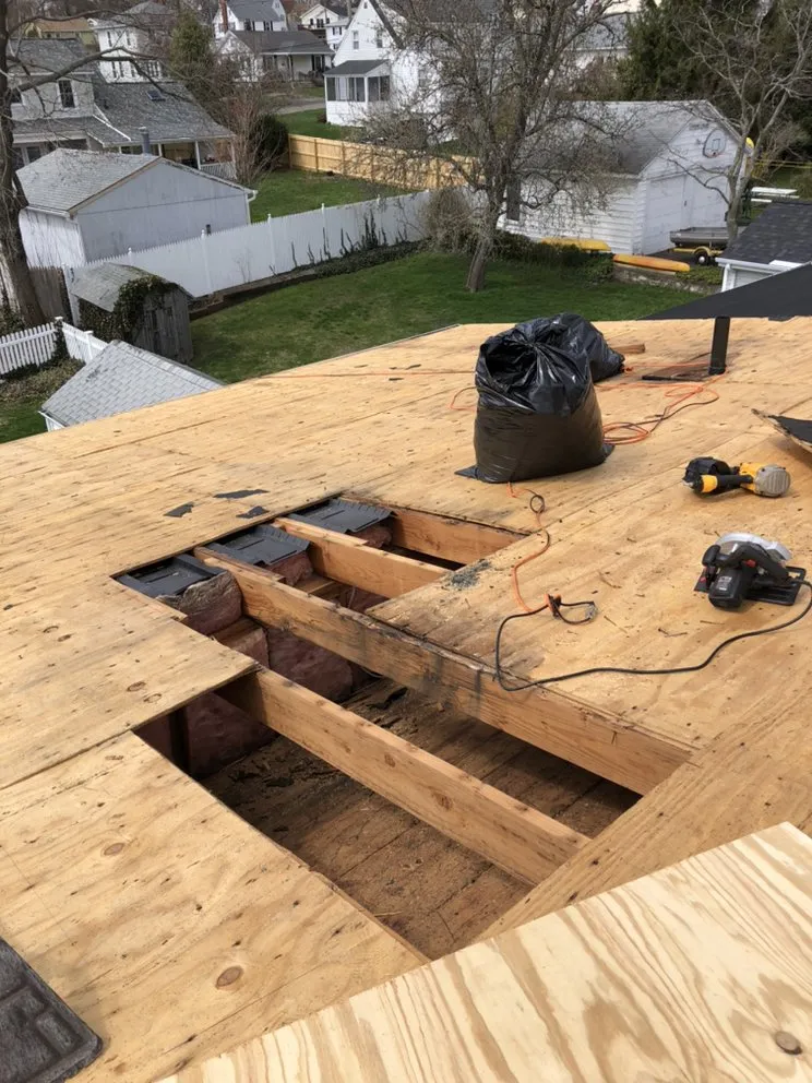 Slide of Nutmeg Roofing Company