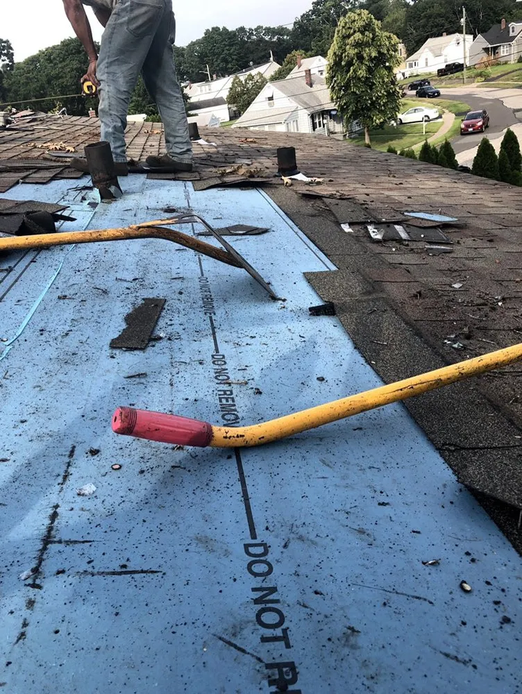 Slide of Nutmeg Roofing Company