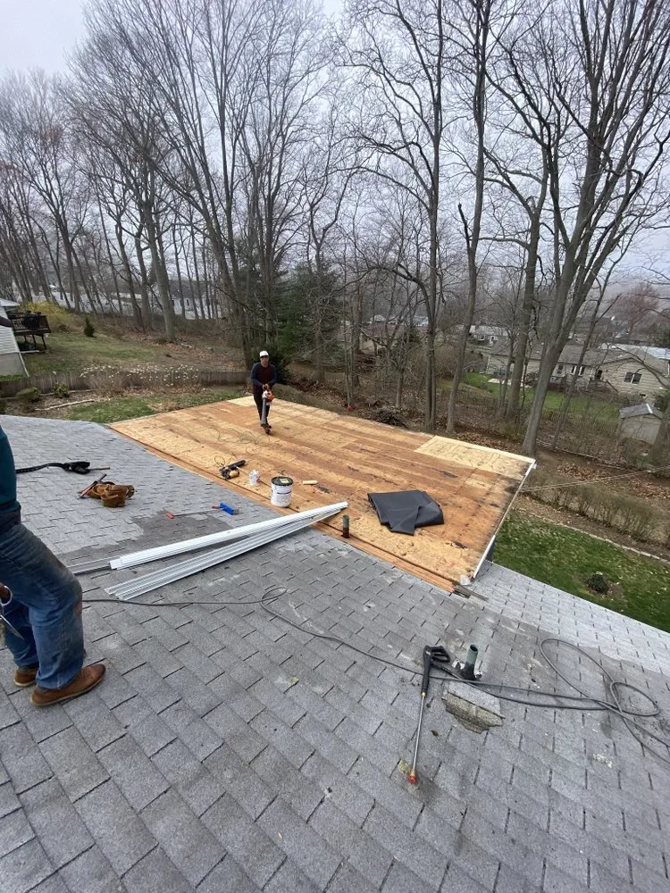 Slide of Nutmeg Roofing Company