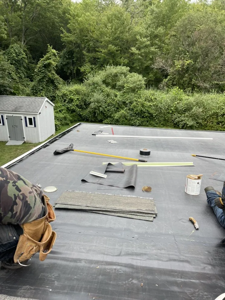 Slide of Nutmeg Roofing Company