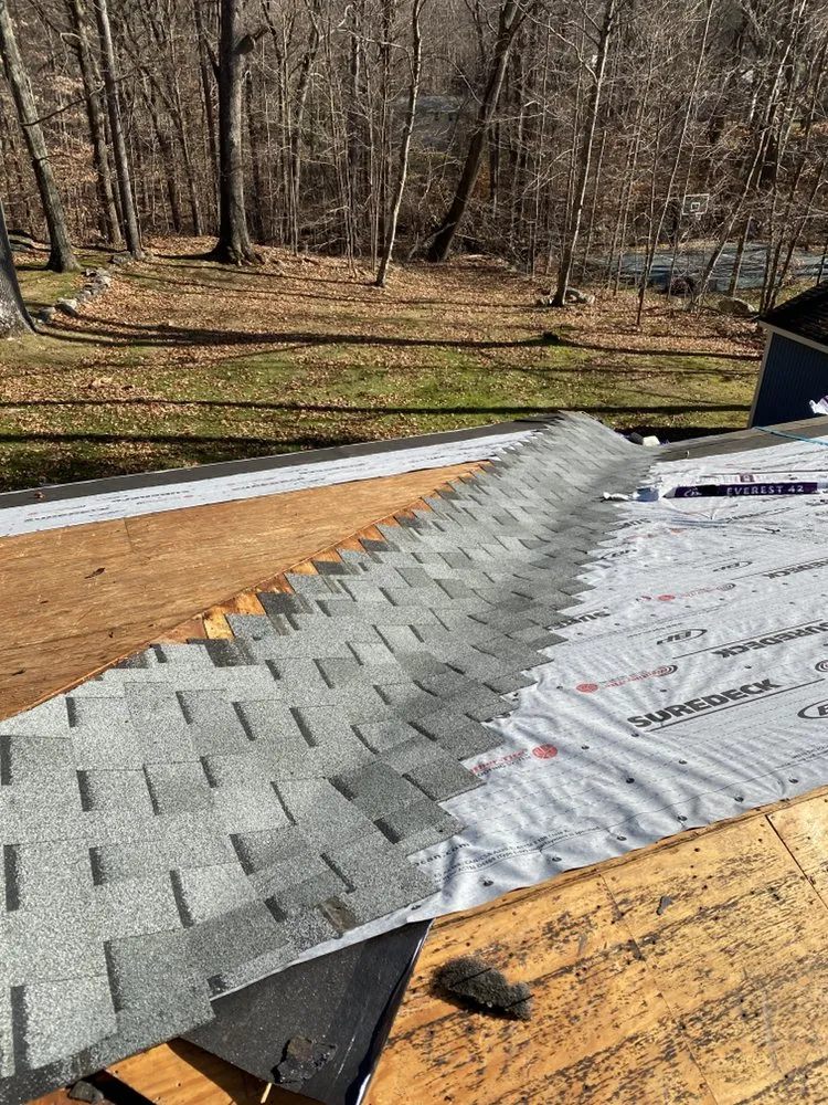 Slide of Nutmeg Roofing Company