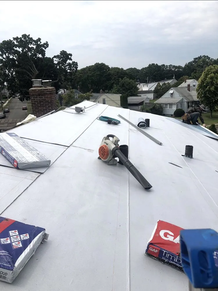 Slide of Nutmeg Roofing Company