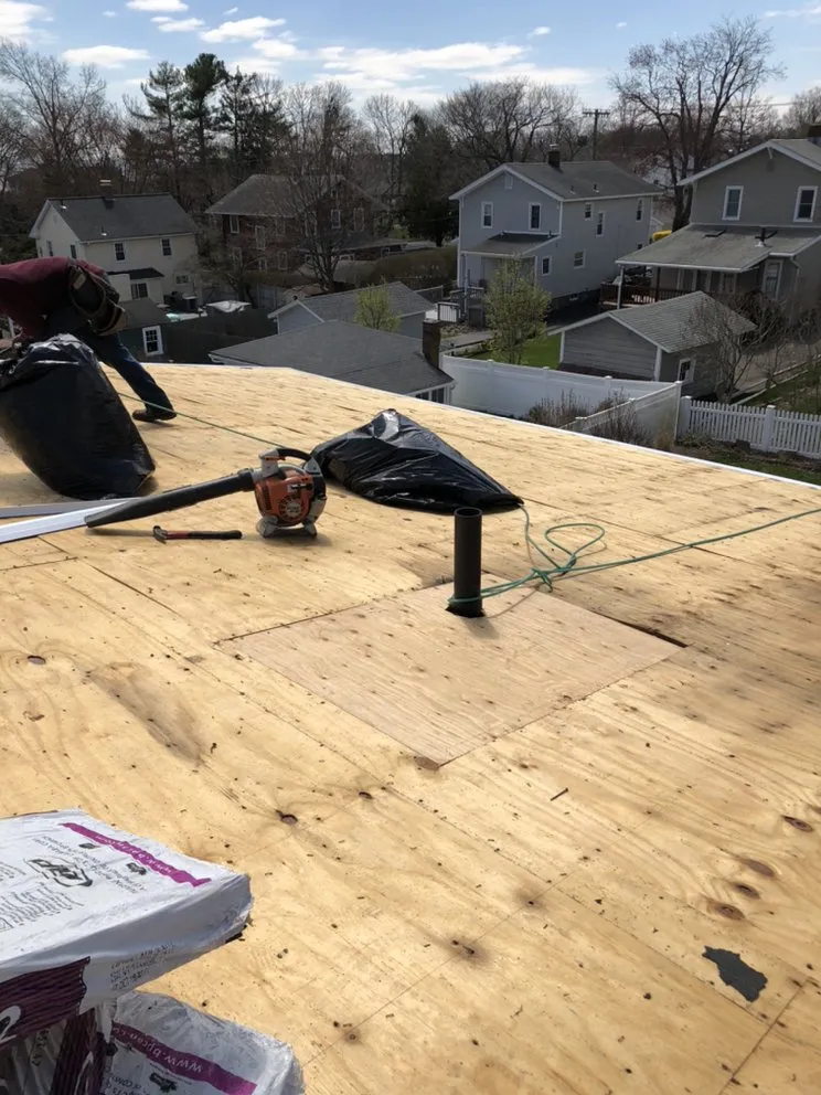 Slide of Nutmeg Roofing Company