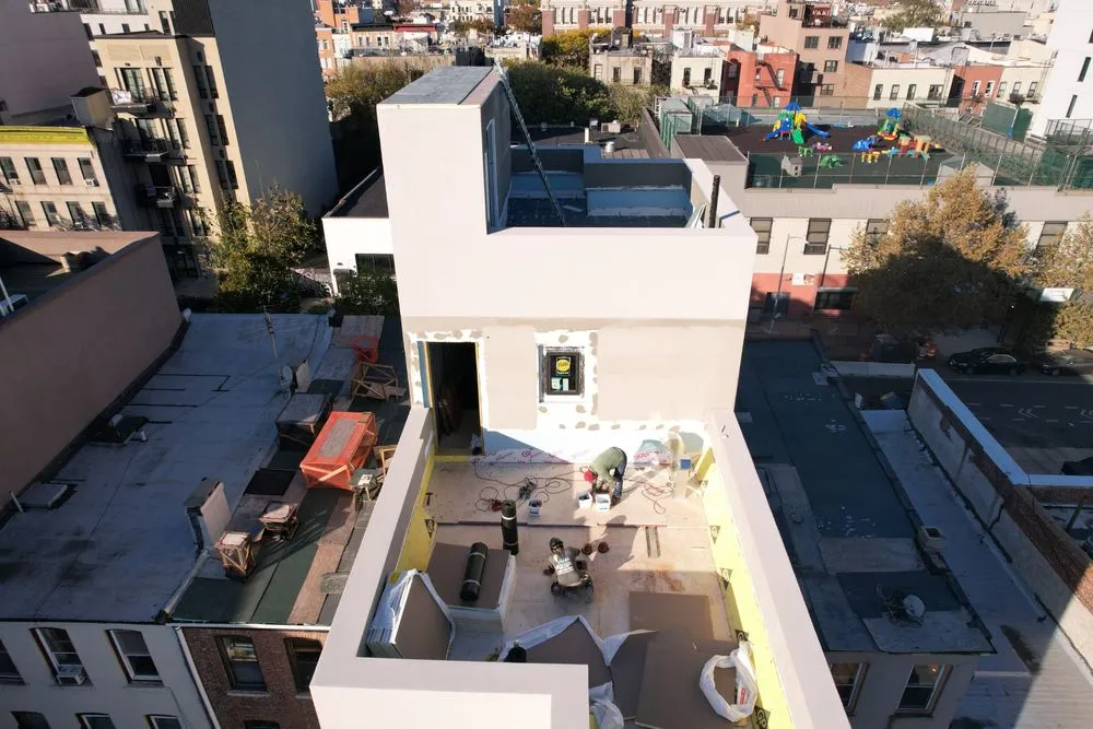 Slide of NY Best Roofer