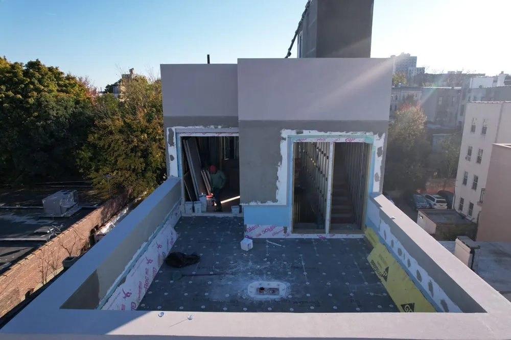 Slide of NY Best Roofer