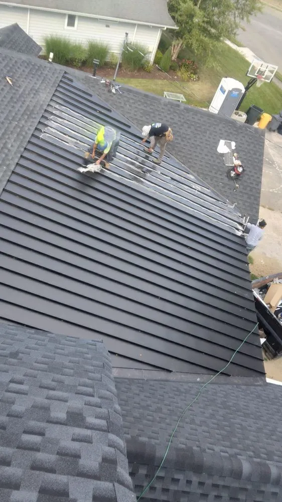 Slide of NY Best Roofer