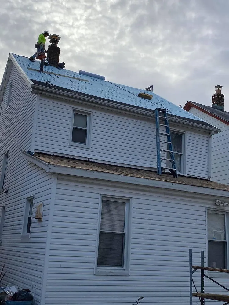 Slide of NYC Best Roofing