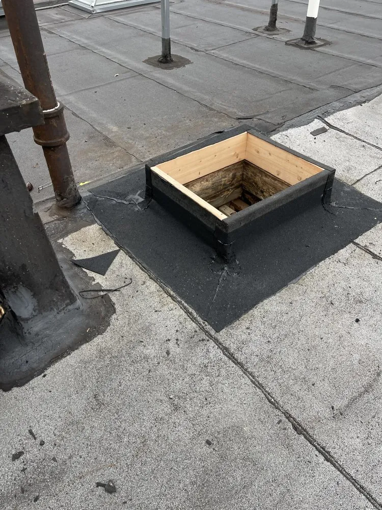 Slide of NYC Rooftop Contractor