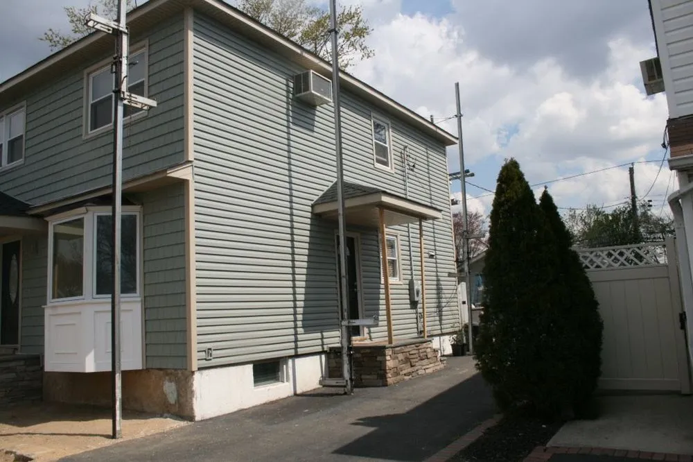 Slide of NY’s Finest Roofing and Siding