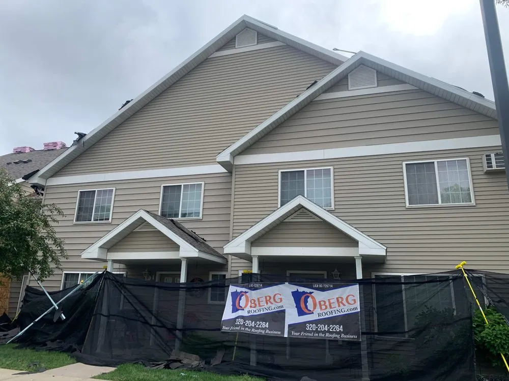 Local storm damage roof repair after storm damage in St. Cloud, MN by Oberg Roofing & Remodeling
