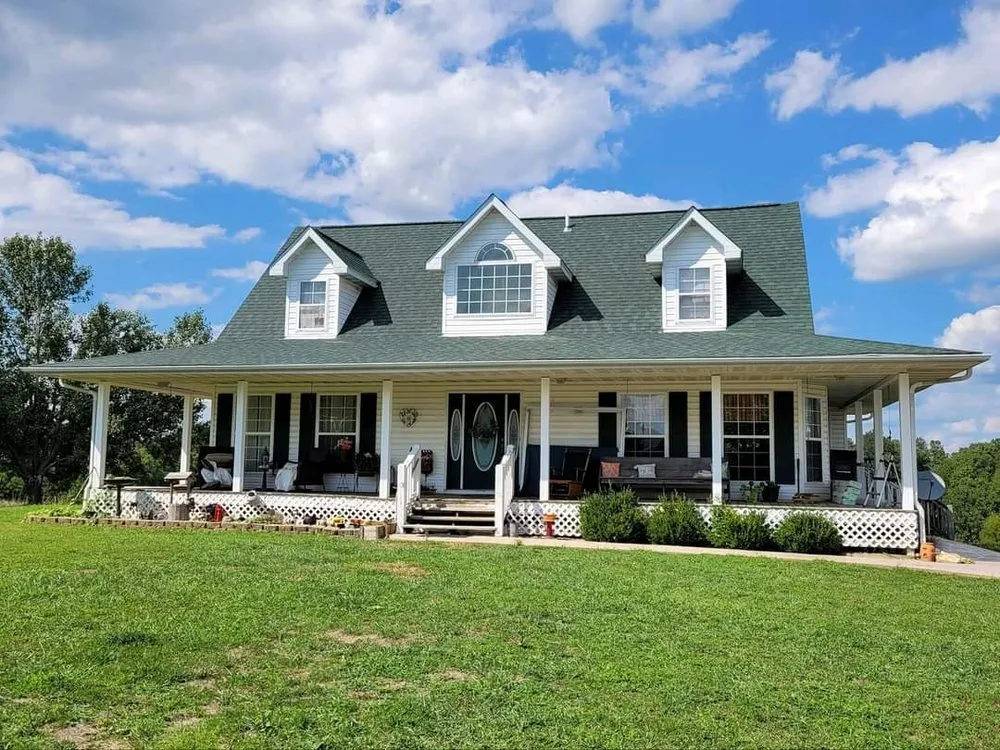 Licensed shingle roofing service for homes in Pottersville, MO by Ogden Family Roofing
